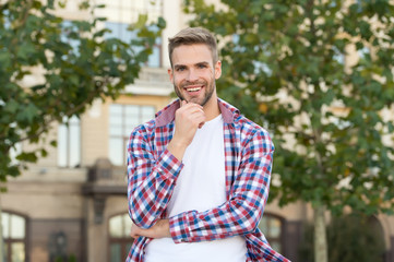Cool about being scruffy. Unshaven guy smile urban outdoor. Happy man with unshaven face. Bachelor...