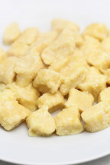 Gnocchi. Small soft dough dumplings with cottage cheese on plate.