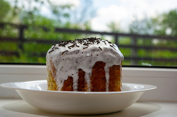 Paska in a plate by the window.