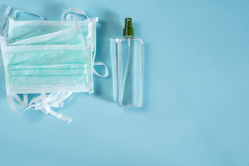 protective mask and disinfectant over table