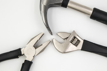 Pliers, hammer, wrench isolated in white background