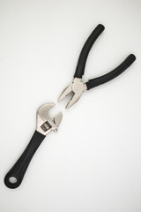 Pliers, hammer, wrench isolated in white background