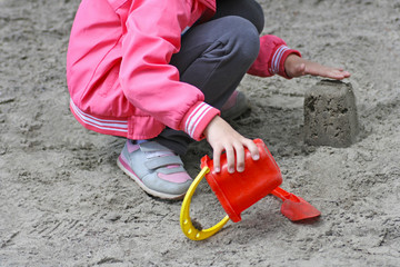 Children's games in the sandbox on the Playground.