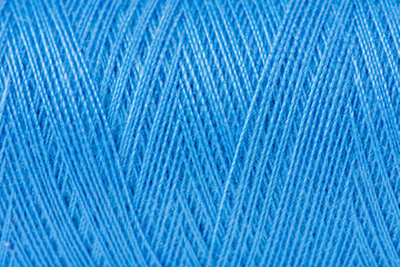 Closeup of thread wuond on spool.