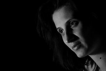 portrait of a girl in red light on a black background