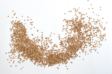 Fototapeta premium buckwheat groats on a light background, closeup texture