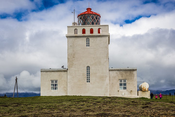 Fototapeta na wymiar Lighthouse of Dyrholaey formerly known as Cape Portland located on the south coast of Iceland