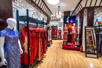 Shop with traditional Chinese clothes in Qianmen shopping area in Beijing city, China