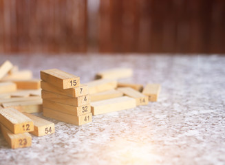a pile of wooden blocks on the jenga table