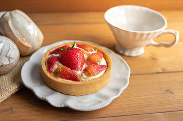 Strawberry Cream Cheese Tart on the table with a cup of tea.