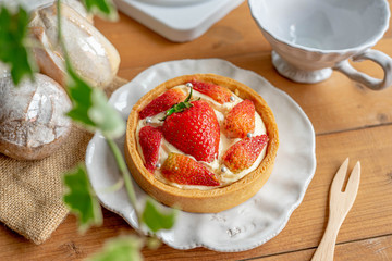 Strawberry Cream Cheese Tart on the table with a cup of tea.