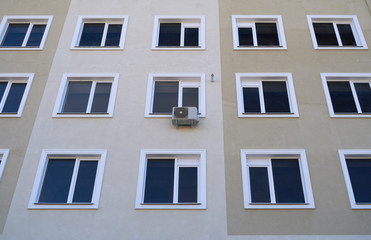 Fototapeta premium one air conditioner outside unit on a facade of residential building