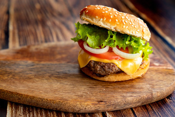 homemade hamburger on a wooden board. 