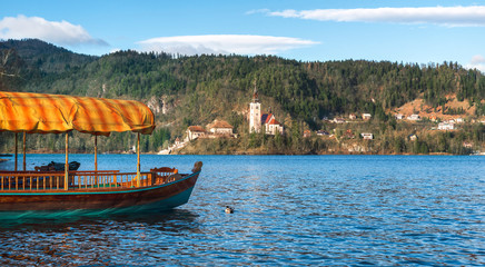 Fototapeta na wymiar Tourist boat in a landscape on the Lake Bled in Slovenia
