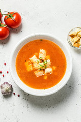 Creamy basil tomato soup. Top view, copy spce.