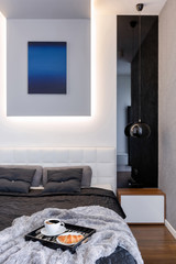 Elegant bedroom with breakfast in bed