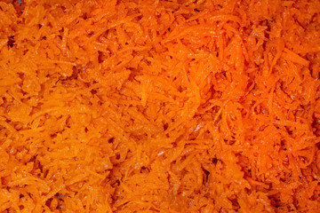 Grated carrot fresh background. Top view texture.