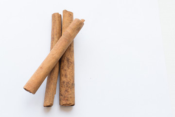 Cinnamon sticks on a white background