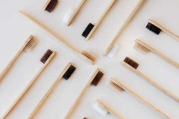 Group of eco bamboo toothbrushes, on white background. Different color. Top view, copy space....