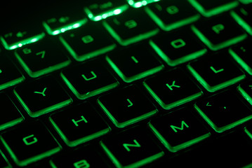 computer keyboard with green key