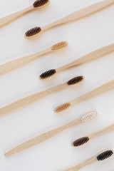 Group of eco bamboo toothbrushes, on white background. Different color. Top view, copy space. Natural organic product for oral hygiene. Dental zero waste and no plastic concept. Safe for the earth.