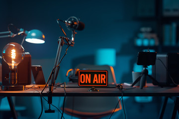 Live online radio studio with on air sign - obrazy, fototapety, plakaty