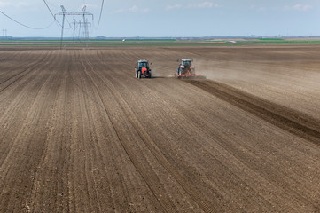 Two tractors working in the field