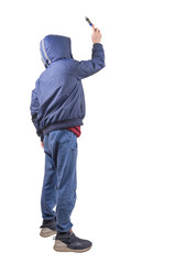 Naklejka premium Back view of teenager wearing a hoodie