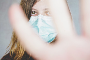 Young woman wearing a protective face mask