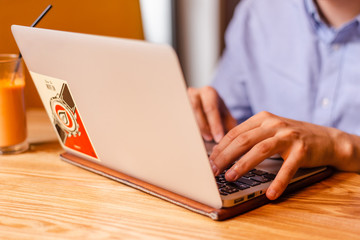 home office essentials. pen in hand closeup. boy studying. successful man at work. stylish man working at home. man typing