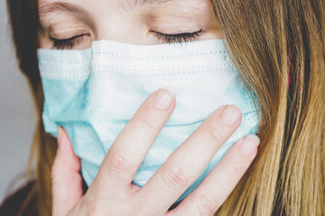 Young woman wearing a protective face mask