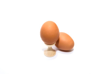Two brown eggs isolated on the white background.