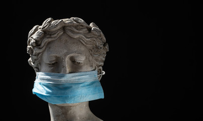 Italian statue in protective blue mask