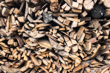 Preparation of firewood for the winter and use for cooking, firewood background