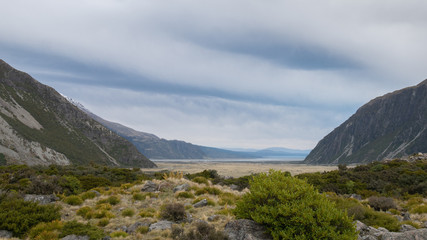 Vista on alpine valley with cloudy skies. Shot at Aoraki/Mt Cook National Park, New Zealand