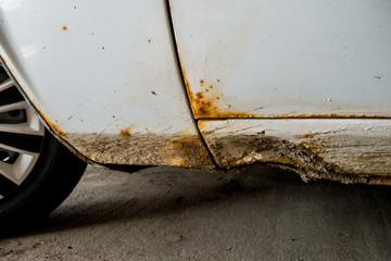 Car body surface with damage due to accident. Close-up