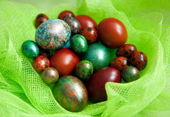 multicolored easter eggs in a basket