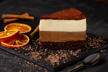 chocolate cake with slices of orange and cinnamon