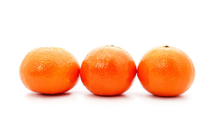 Three orange mandarins.
