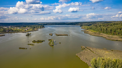 Aerial view of the lake in the middle climatic zone , roads and villages surrounding