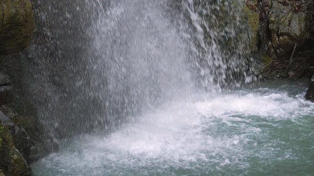 Motion Blur Waterfalls Peaceful Nature Landscape in Mountains. Waterfall at small river near Rosa Khutor resort in Caucasus mountains.