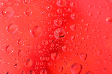 shiny clear water point attached to a glass reflects the same color as the color on the glass into a beautiful background as decoration