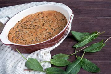 Sweet homemade sorrel pie on a wooden background. Original simple sweet pastries. Dessert