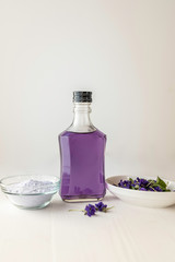 close up  viola violetta odorata skin care product fragrant lilac soap with lilac spa bath salts and tincture body oil
