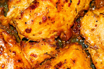Chicken breast baked in the oven with spices. Close up.