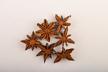 Several star anise inflorescences on a white background. Close up.