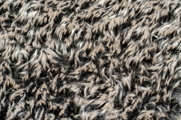 Abstract background of warm gray-brown fur closeup