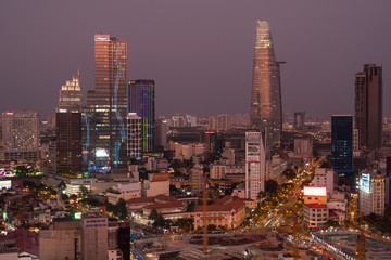 Sunset reflects off skyscrappers in downtown Ho Chi Minh City.
