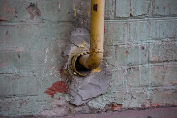 Yellow gas tube is rusty  on house