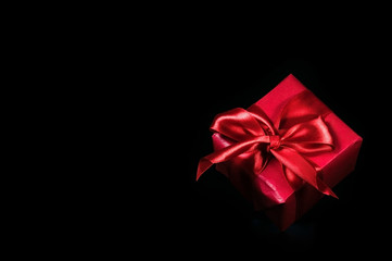 Black friday sale, discounts, gift with red bow, copy space.